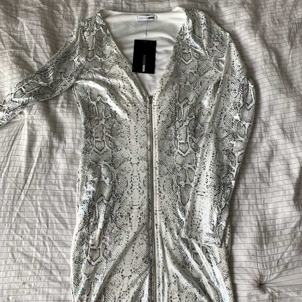 New with tags fashion nova mini dress with a metallic snake print. Size M.
